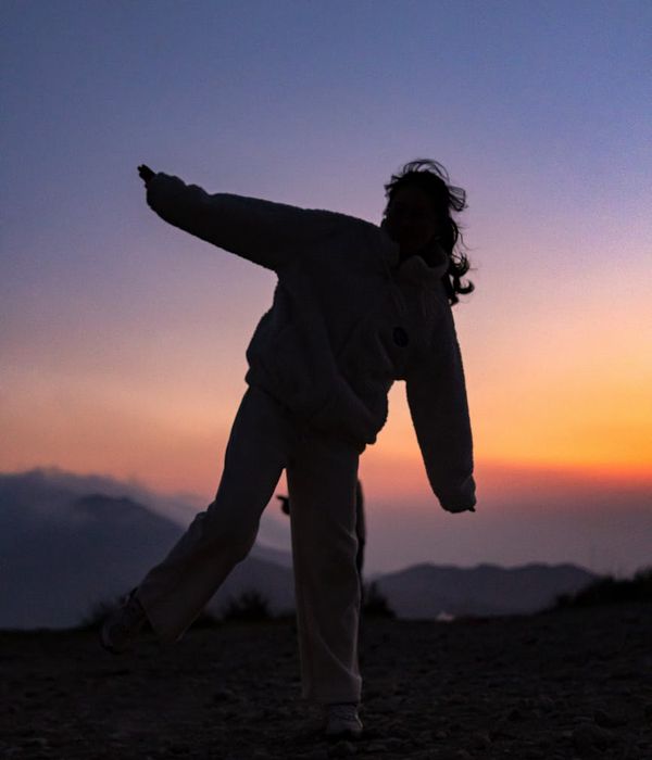 A serene woman looking at the horizon for visual relaxation